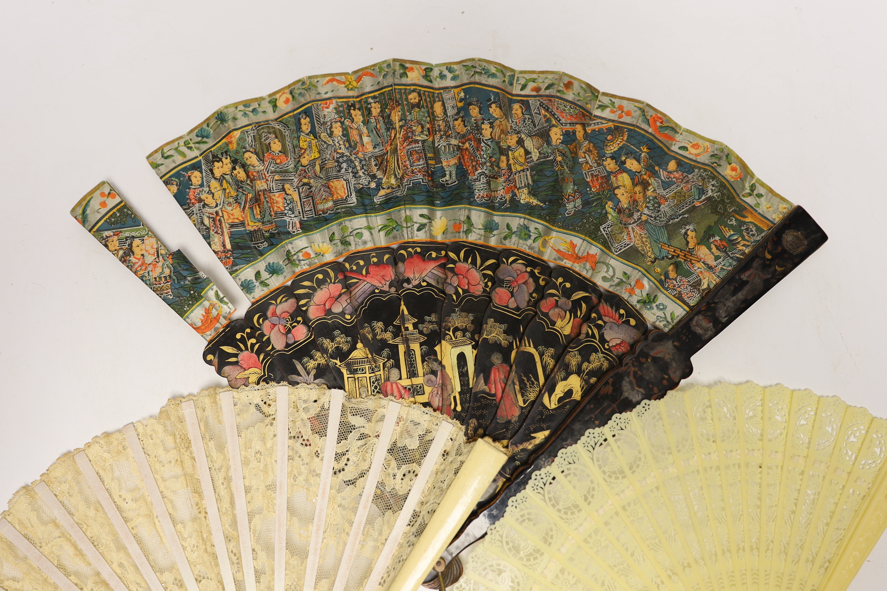 An early 20th century Chinese painted and lacquer fan, together with two others